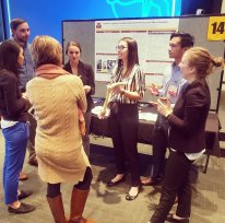 Students presenting senior projects at a poster session