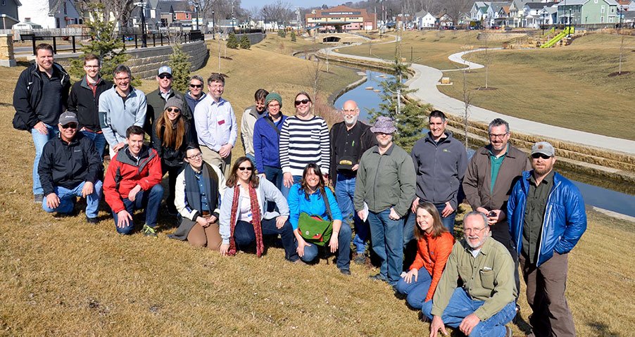 Picture of approximately 15 PRRSUM practitioners at a field site visit