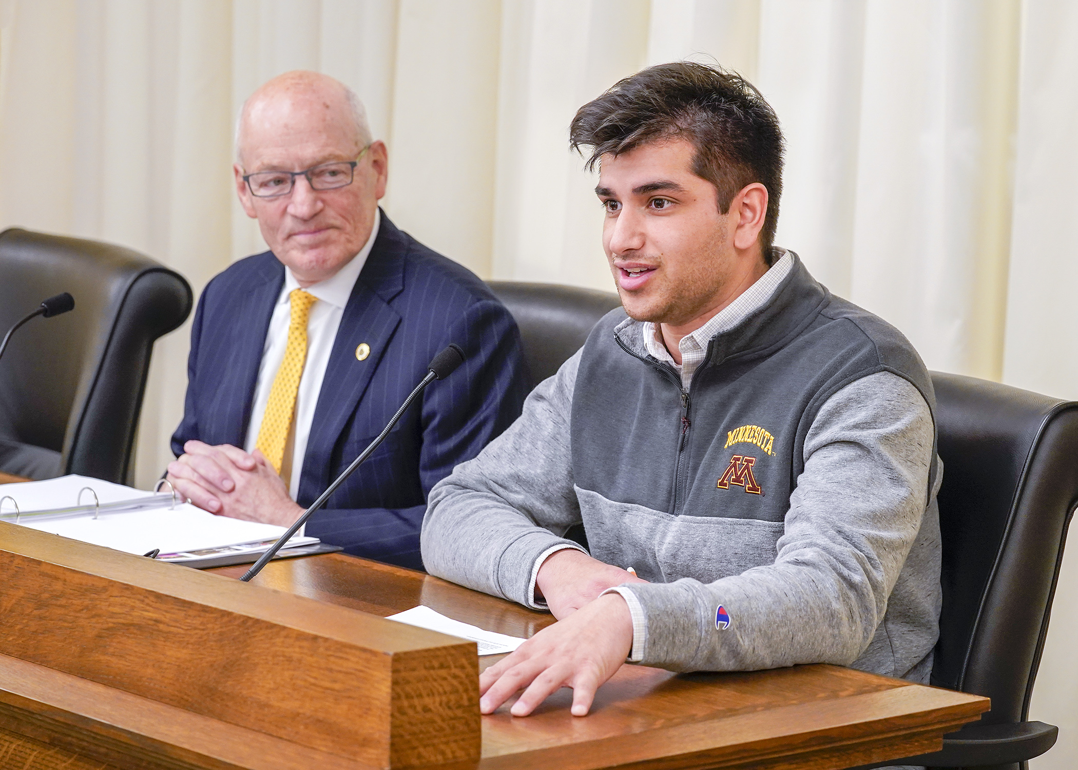 U of M student Mustafa Syed testifies Jan. 18 before House lawmakers with Myron Frans, the school’s senior vice president for finance and operations, during a presentation on asset preservation and replacement needs.