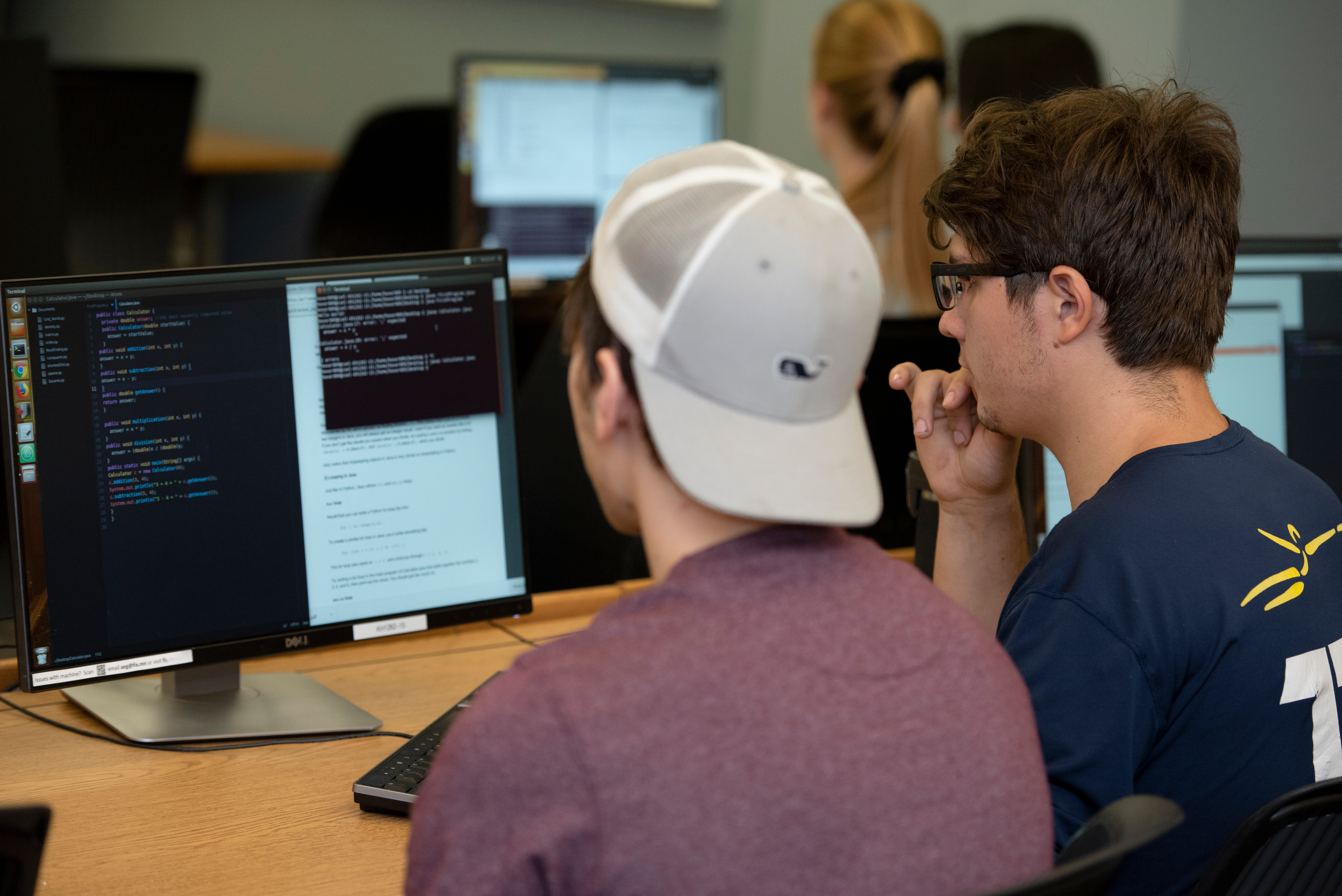 Two students work on a coding project