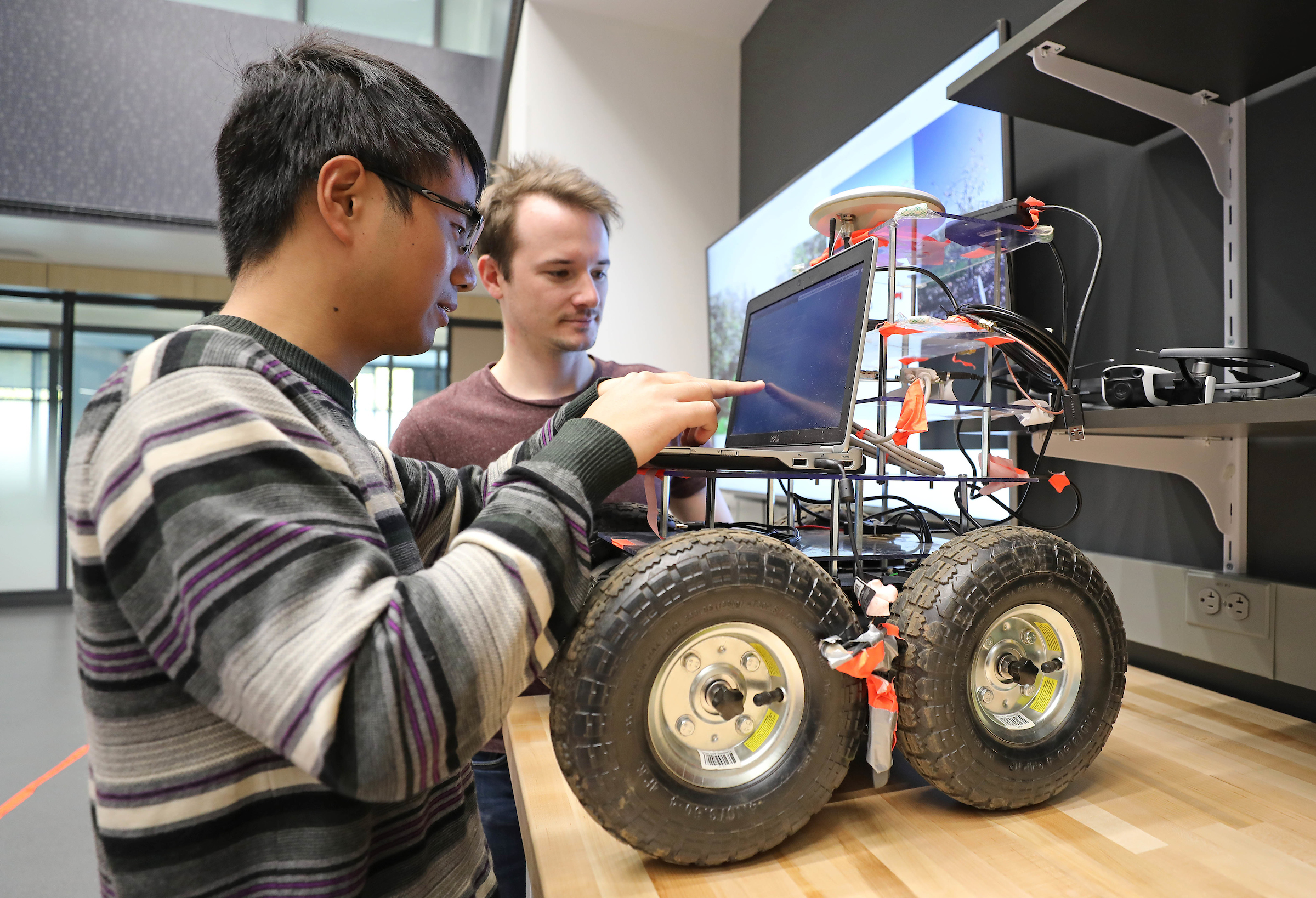 Students working on a wheeled robot