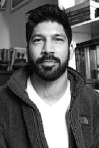 Black and white headshot of Luke Haqq