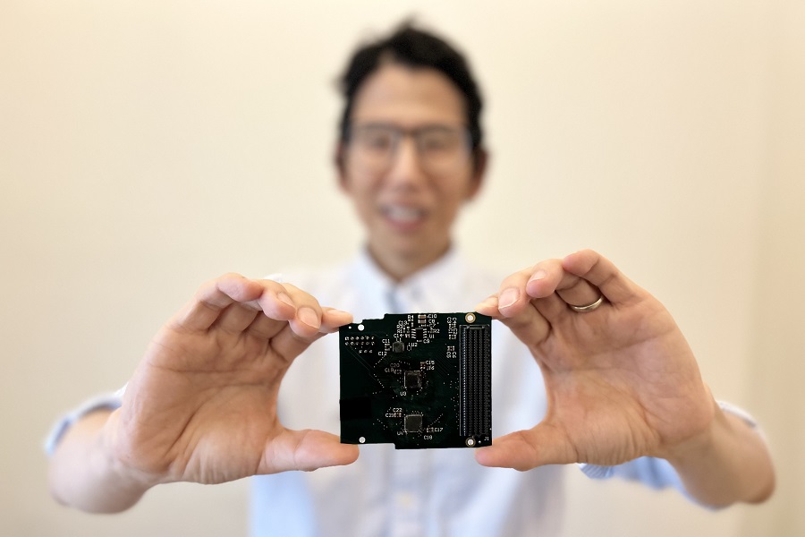 Prof. Chris Kim holding the fabricated chip in his hands