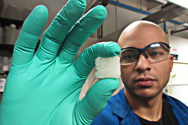 Researcher holding a piece of foam
