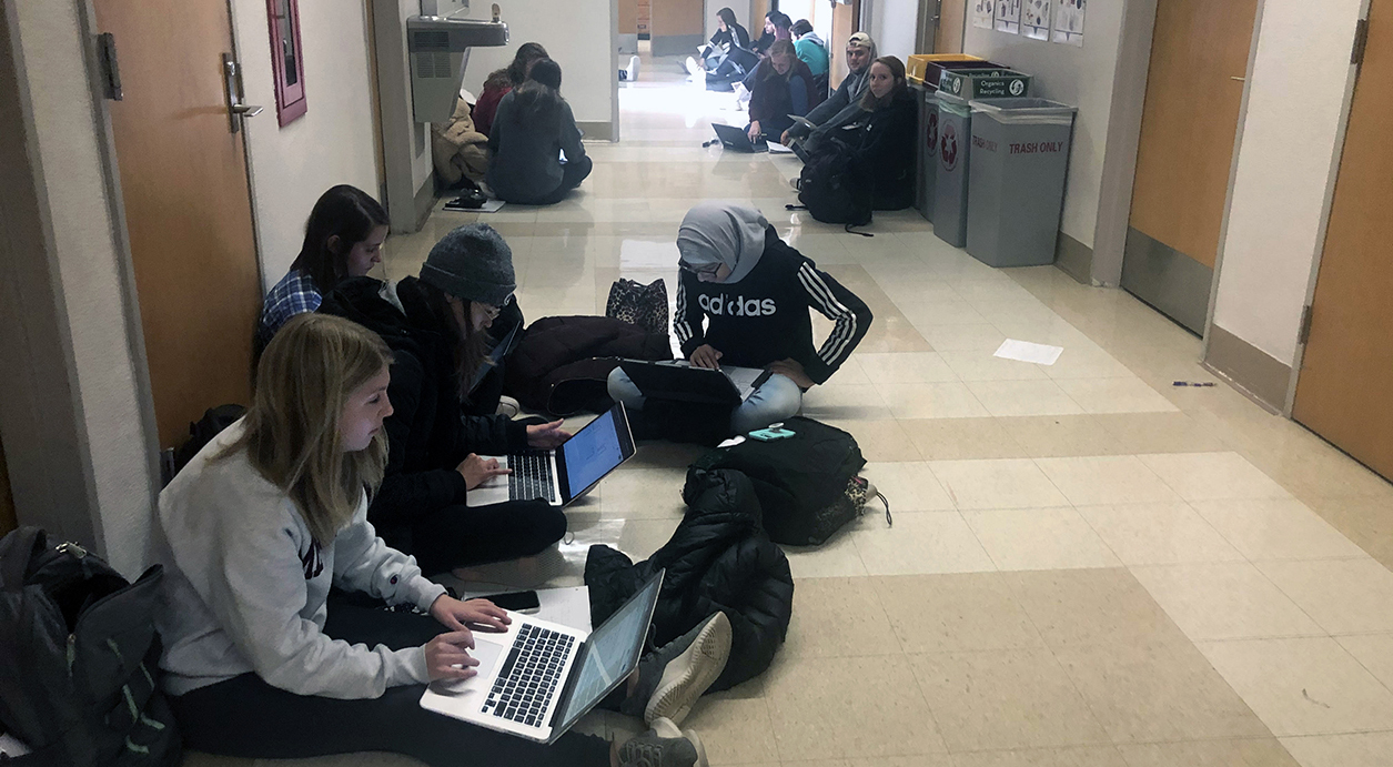 current Smith Hall collaboration space: students sitting in hallway