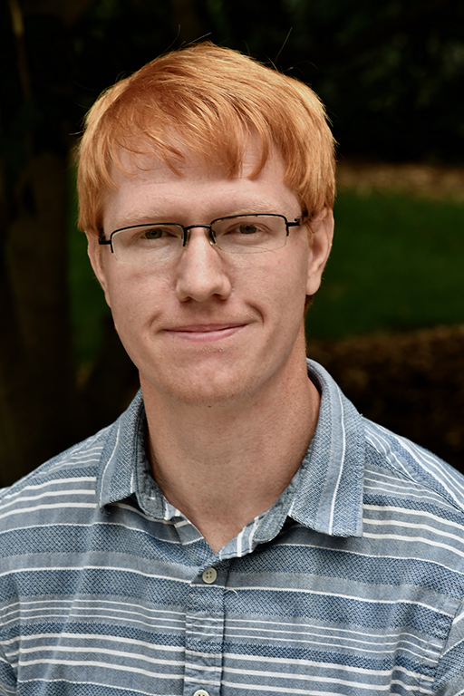 Red headed man with glasses