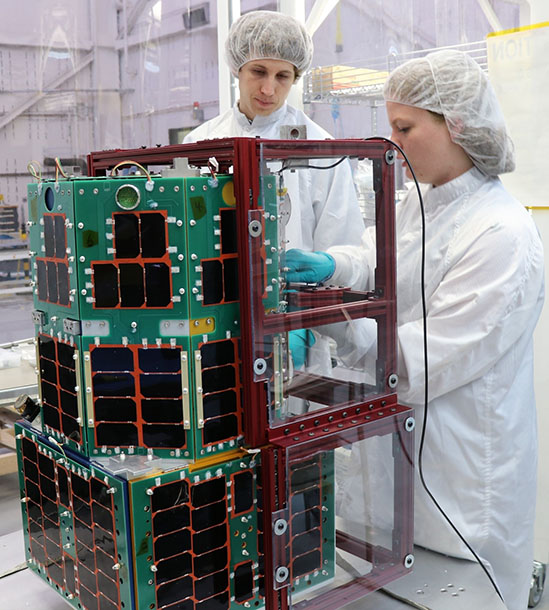 Two University Nanosatellite Program students 