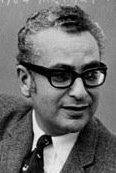 Black and white picture of person with glasses looking off to their left