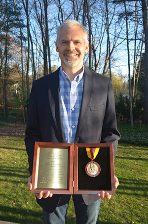 Dan Hickman with Award