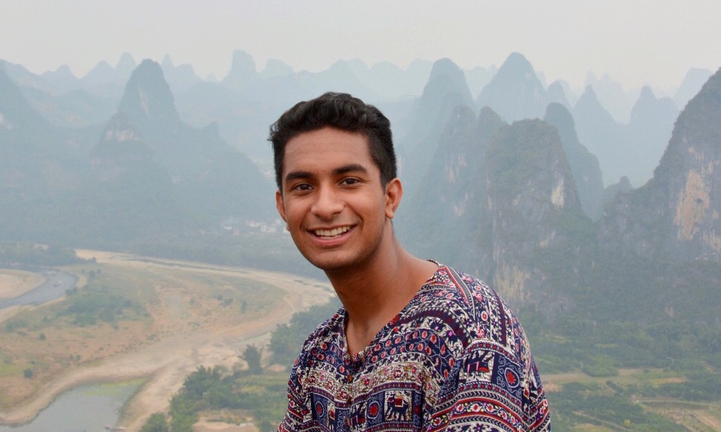 Student with mountains in the background