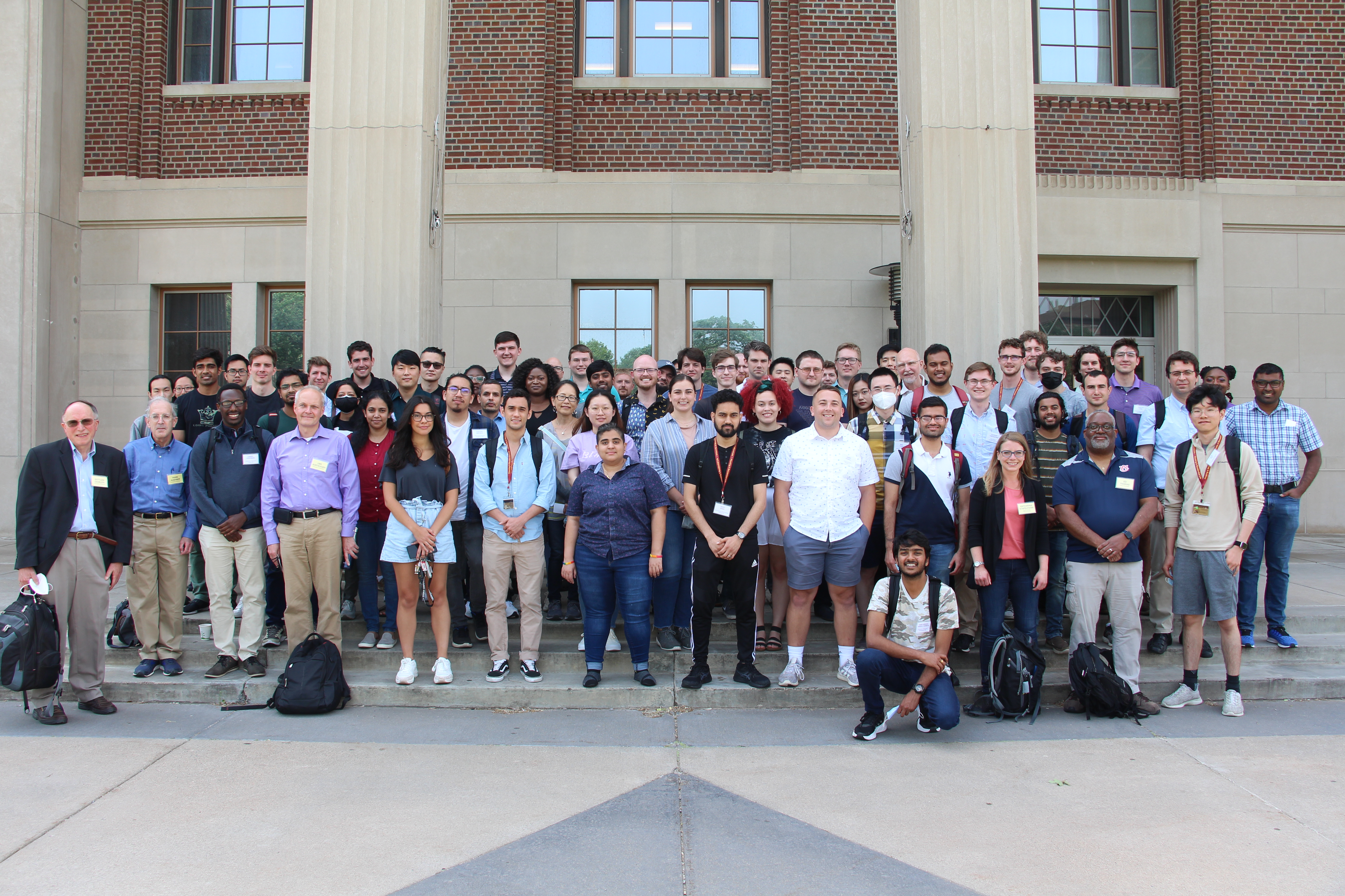 Participants in the 2022 Plasma Summer School gather on the steps of Coffman Union