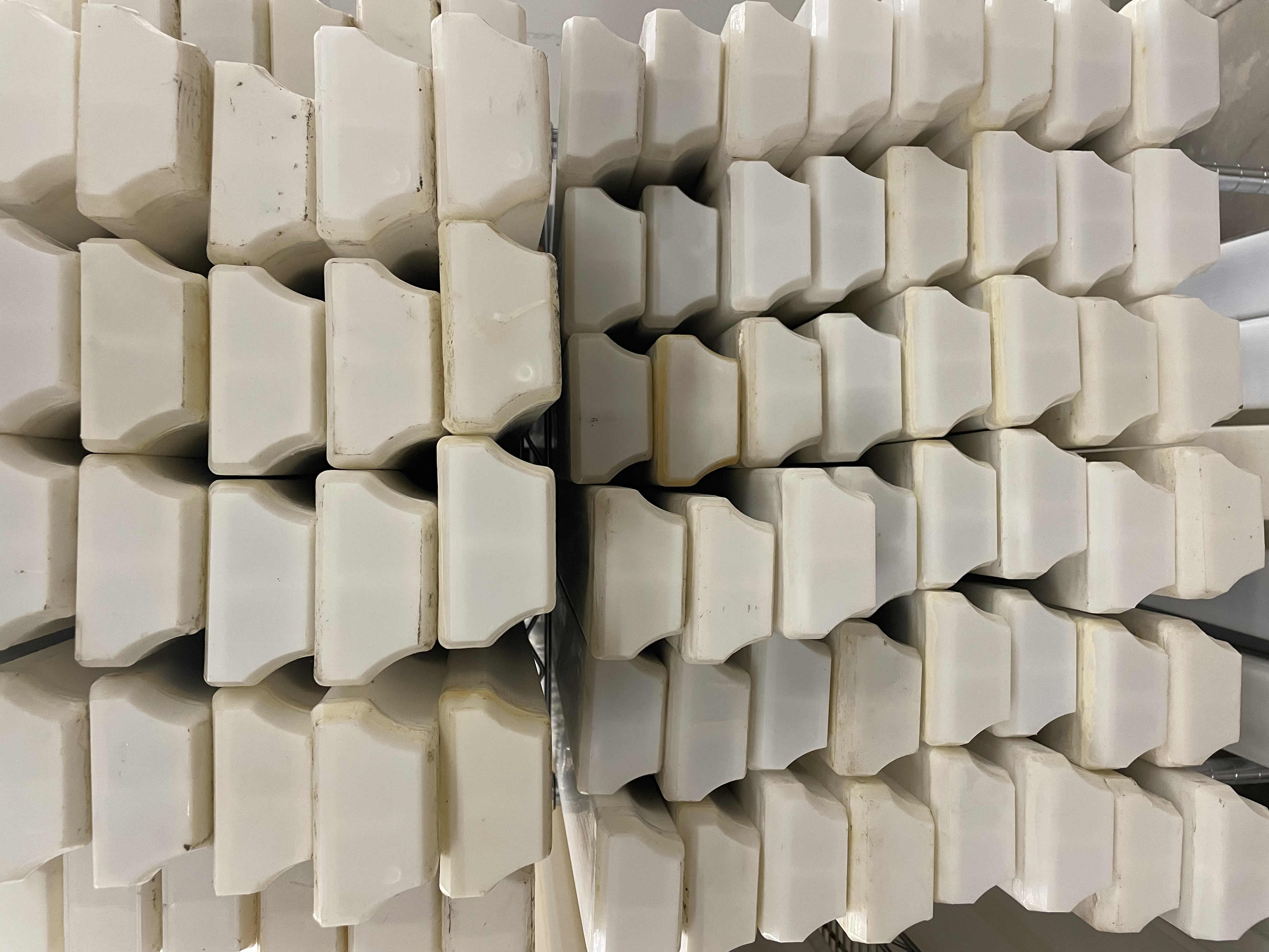 Large stack of white D tubes