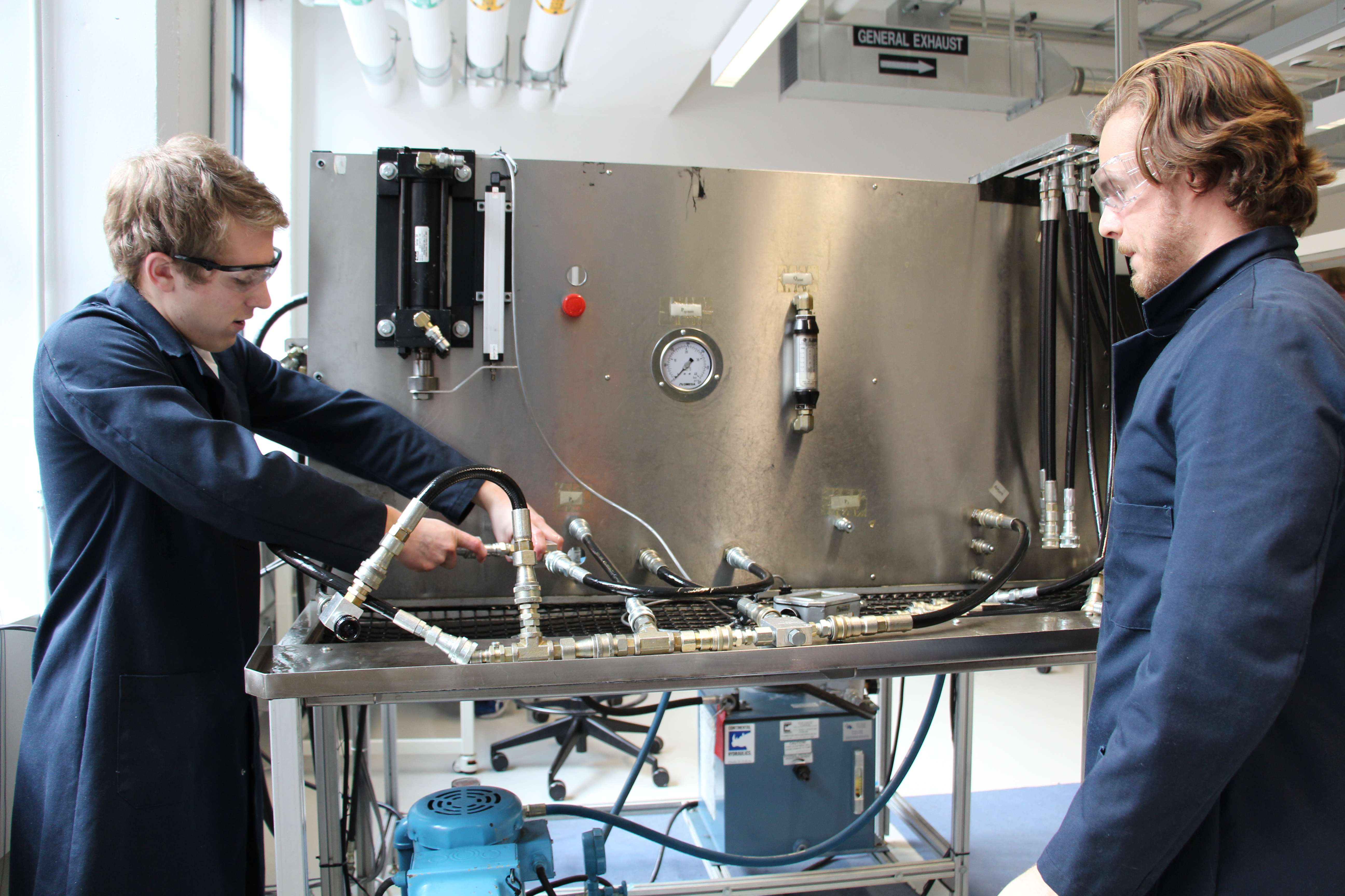 Two students in the fluid power lab