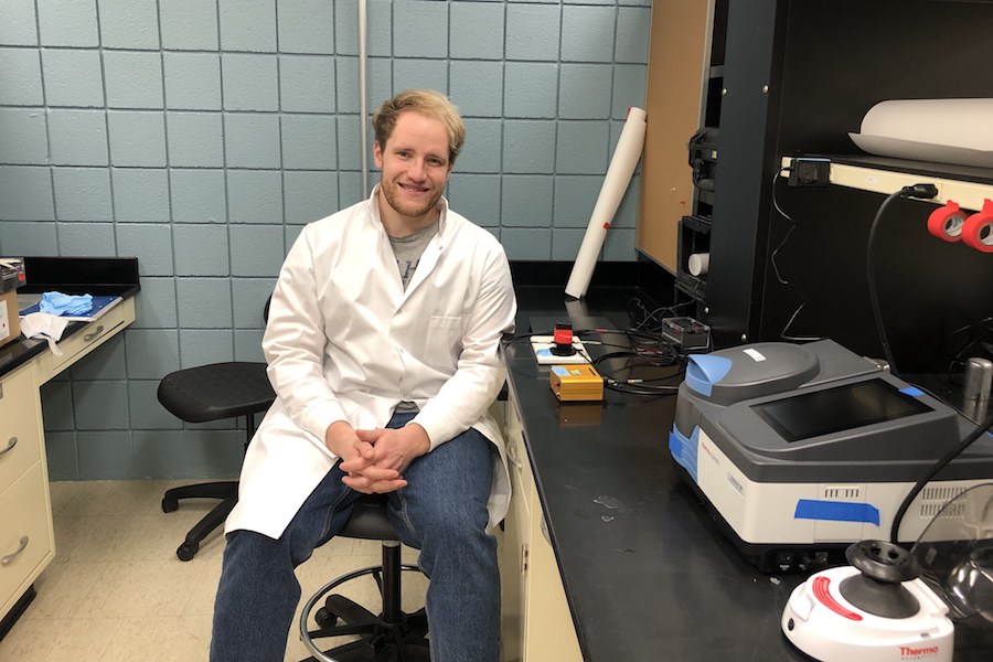 Researcher Peter Christenson posing for a photo in his lab