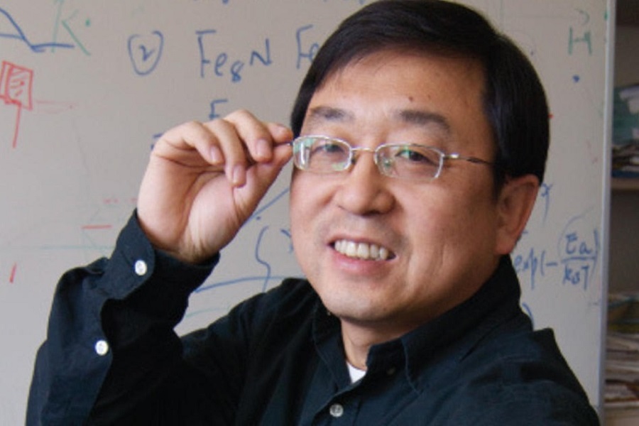 Professor Jian-Ping Wang smiling while adjusting his glasses