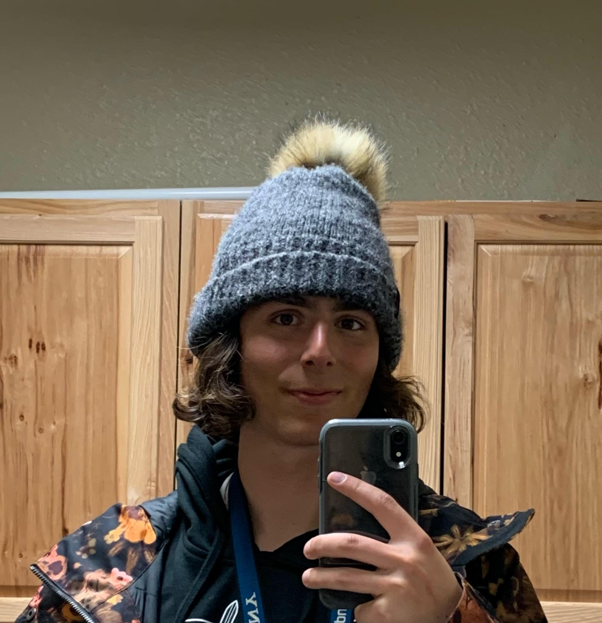 Jonah Calvo takes a mirror selfie wearing a winter hat