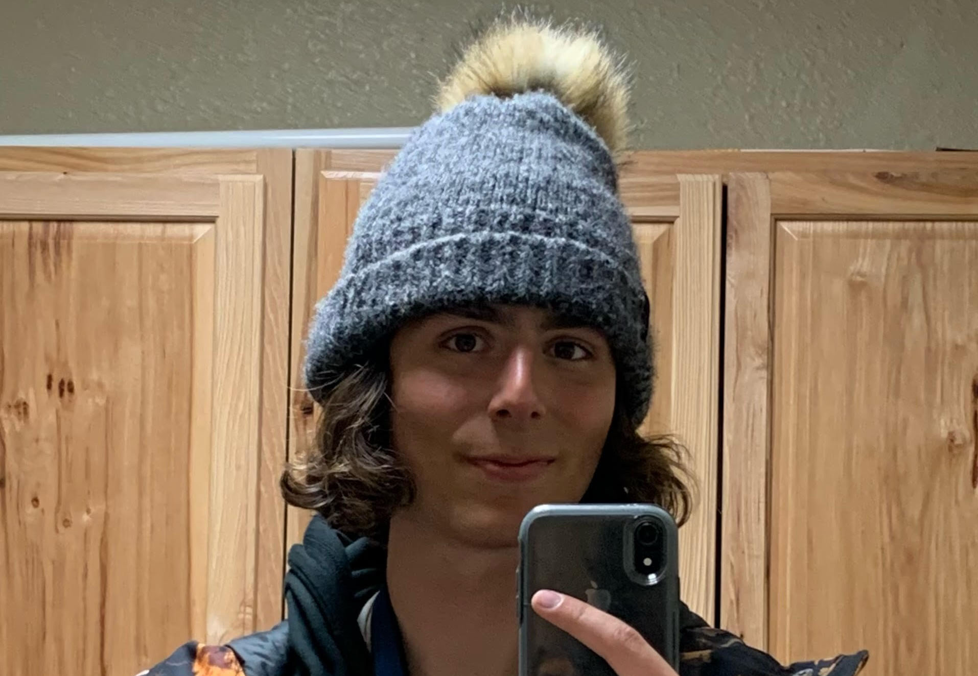 Jonah Calvo takes a mirror selfie wearing a winter hat