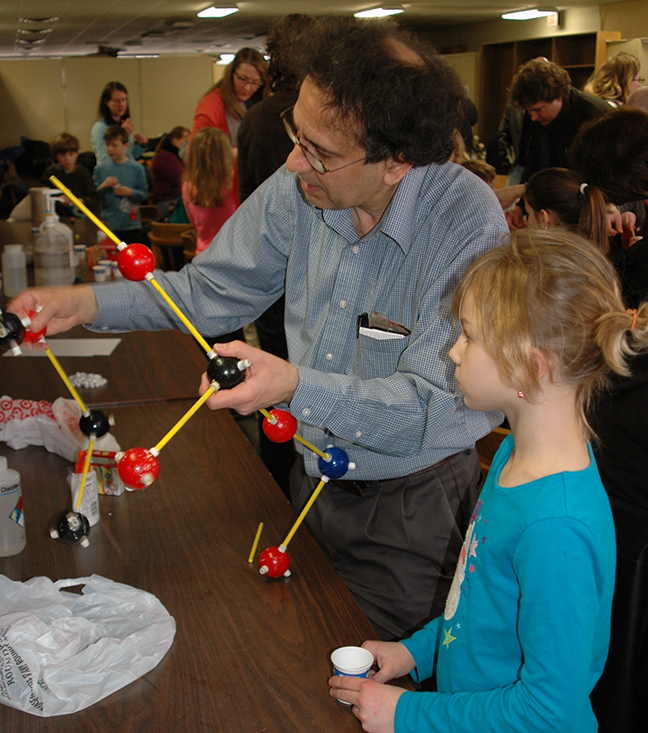 Professor Ken Leopold teaching science to a young person