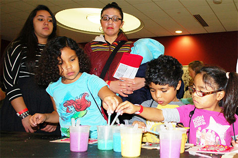 Family participating in the Math and Science Family Fun Fair