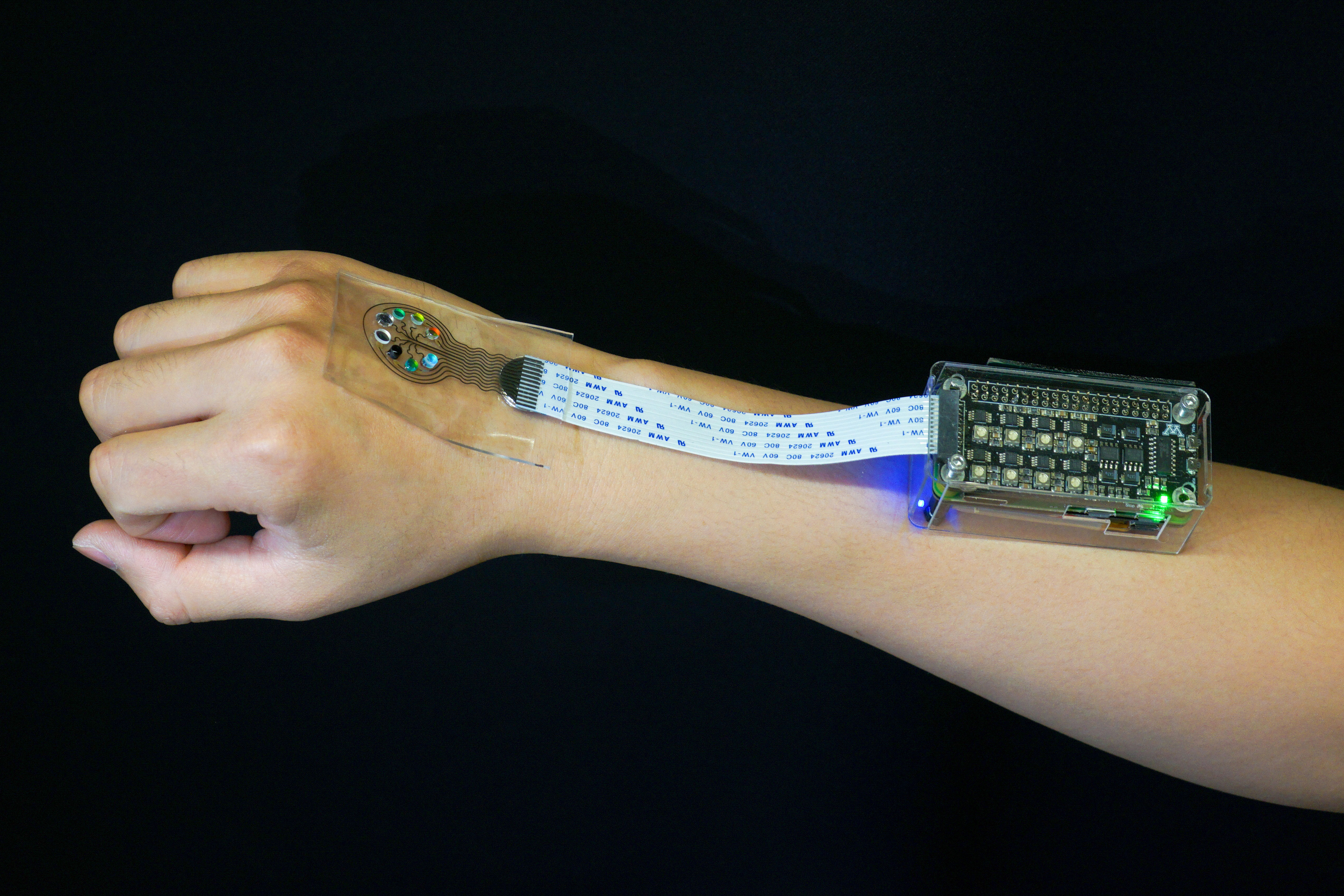 Human arm with light-sensing device attached