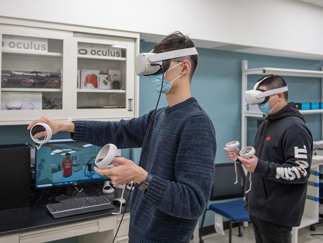 Two students using VR headsets 