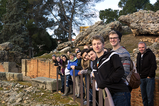 A group of students standing at an outdoor historical site.