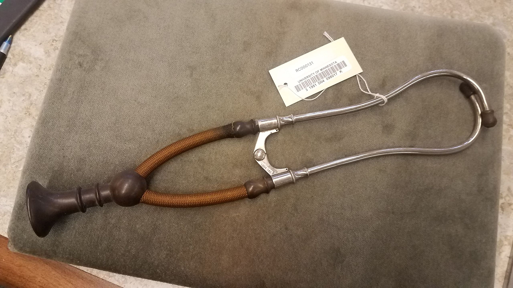 Early 1900s model of a binaural (two-ear-piece) stethoscope, made of rubber, nylon, metal, and bronze from the Wangensteen Historical Library.