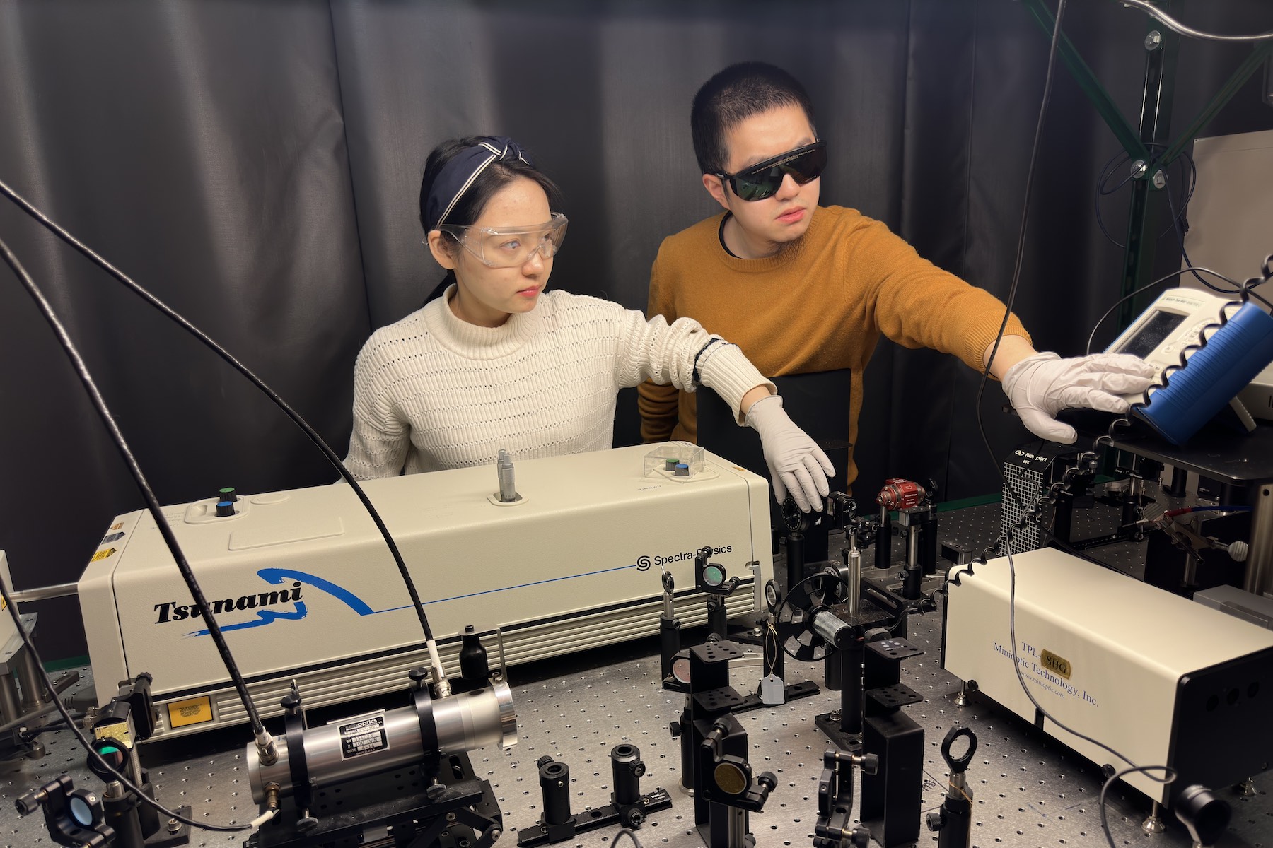 University of Minnesota Twin Cities Ph.D. students Yingying Zhang and Chi Zhang conduct measurements using a home-built system involving ultrafast laser pulses to study the lanthanum strontium cobaltite devices