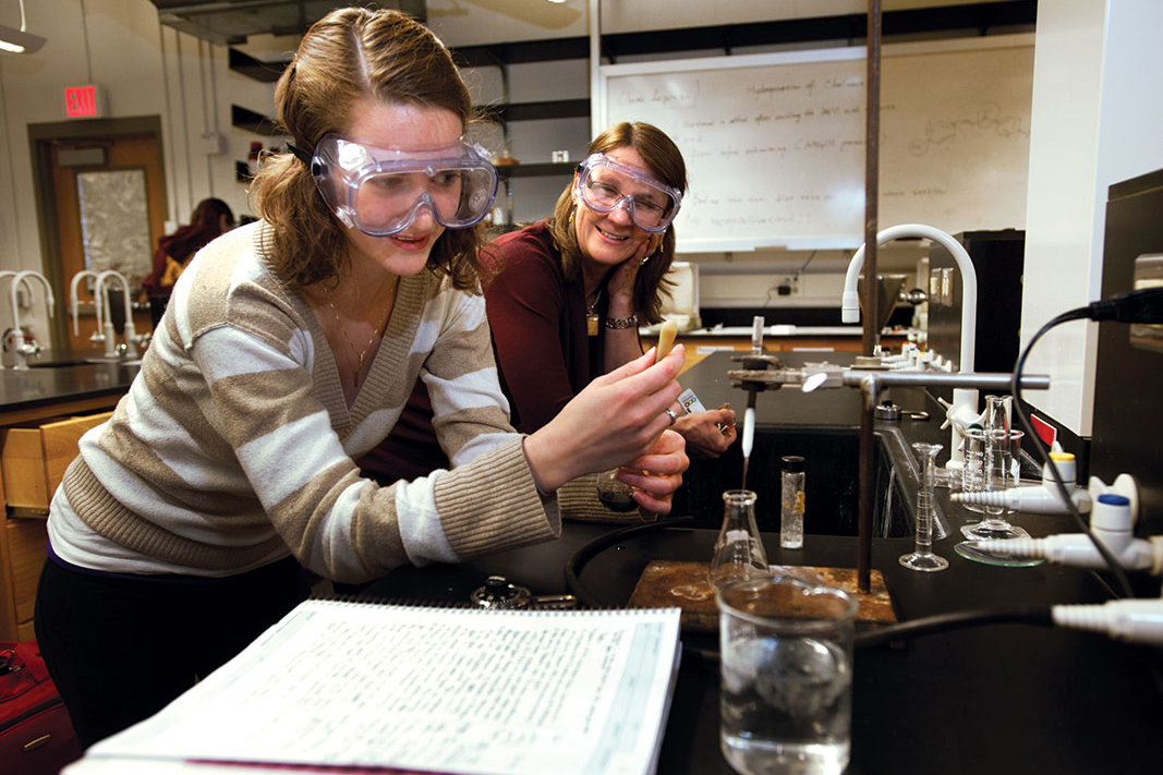 Jane Wissinger with a student in lab