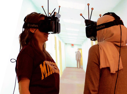 Two computer science students wearing VR headsets
