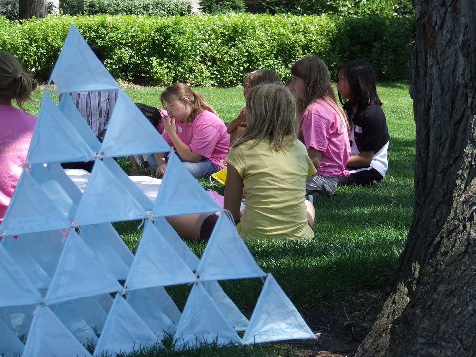 MathCEP Students create a Sierpinski Pyramid outside under trees in summer