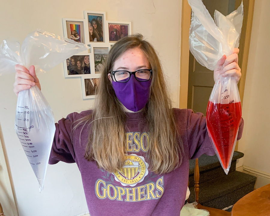 Lexi Kedzierski holds up conical pouches that are part of the DuoPouch design.