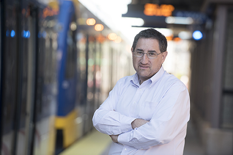 David Levinson standing in front of lightrail