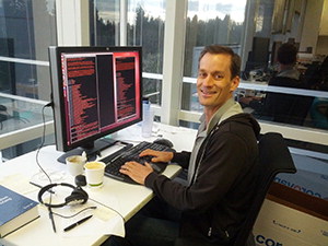 Jeff Dean sitting at computer