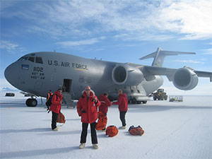 Clem Pryke disembarking plane at McMurdo Station in Antarctica