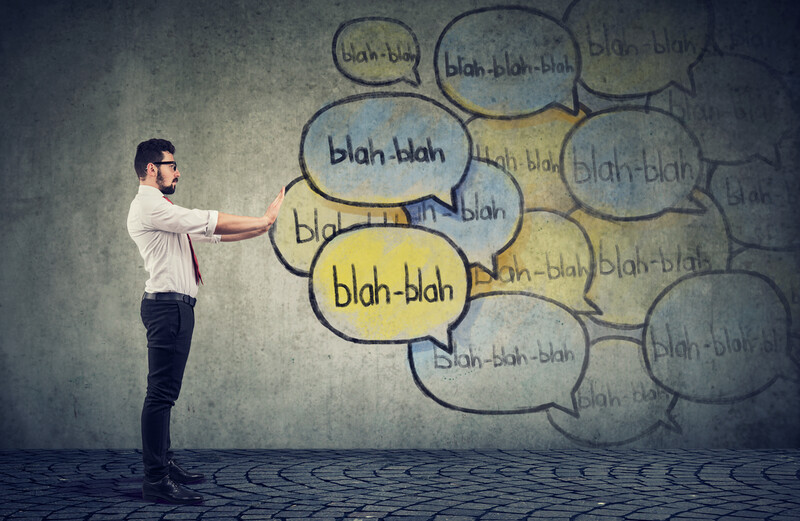 Man in front of "blah blah" message bubbles