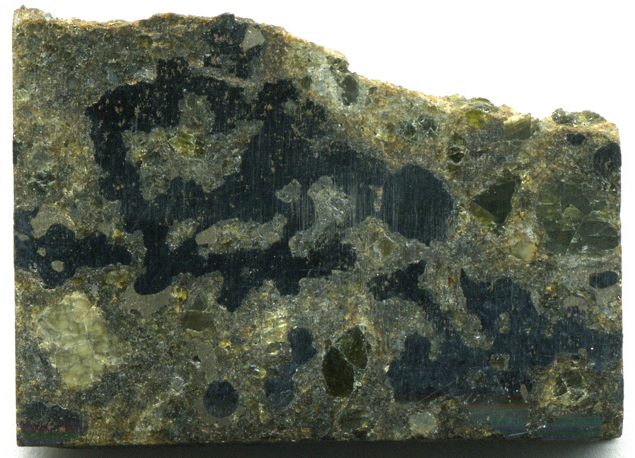 Cut and polished slice of a mesosiderite stony-iron meteorite.