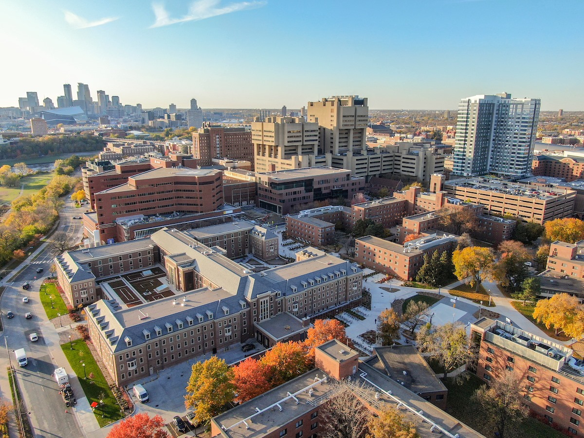 Aerial view of the west bank of the University of Minnesota with downtown skyline in the distance