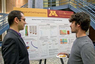 Graduate researchers present their work during spring reception.