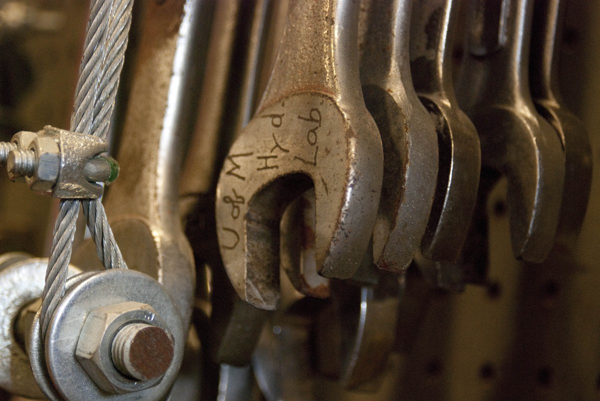 Photo of wrenches hanging in the machine shop, with "U of M Hyd. Lab." engraved on one of the wrenches.