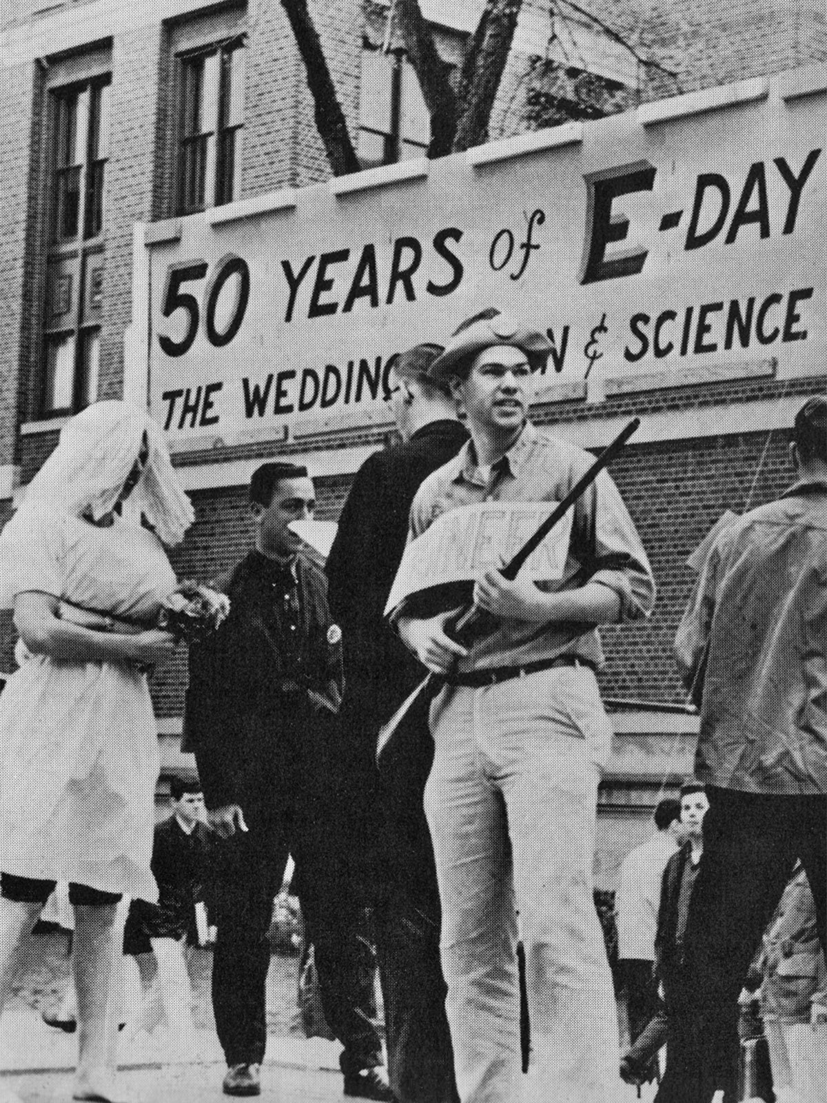 In 1960 E-day’s golden anniversary is represented by a wedding on a float in the parade