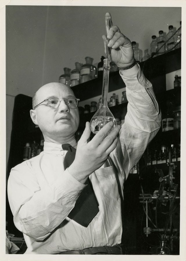 Professor Izaak Mauritis Kolthoff holding a flask