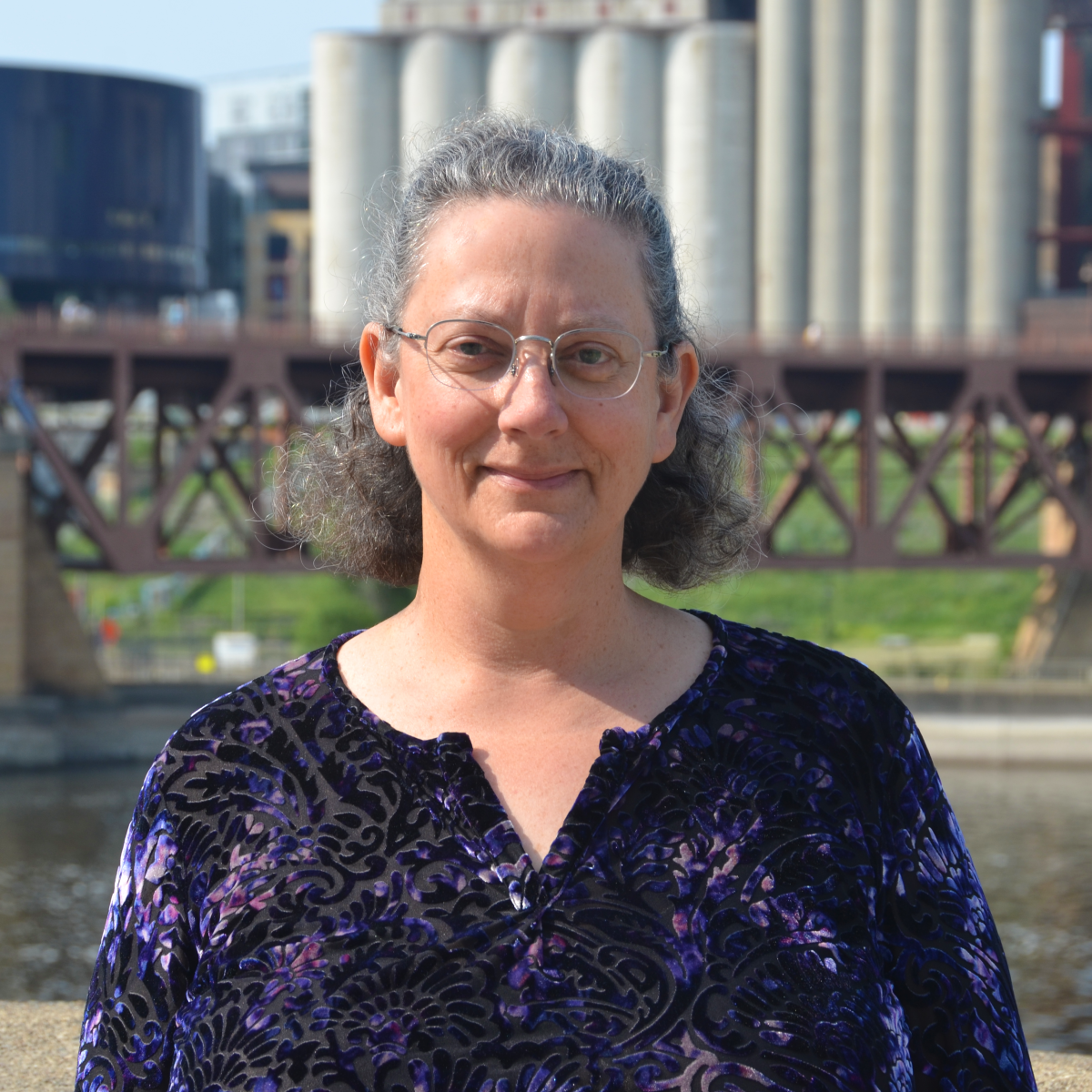 Cheryl Miller in front of St Anthony Falls Lab