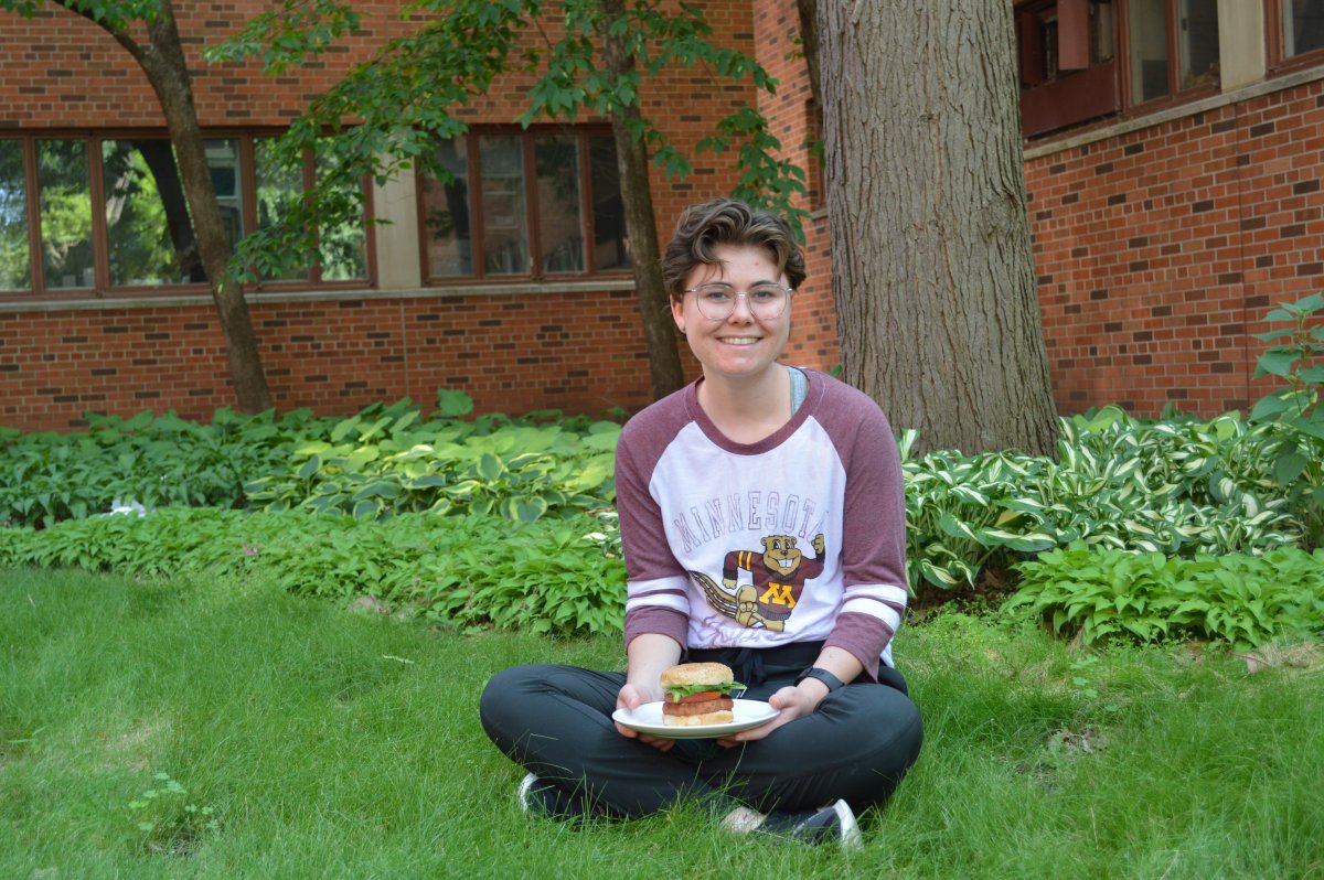 CSE student Maddi Johnson poses with a meatless burger