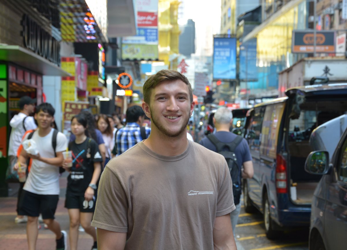CSE student poses in the streets of Hong Kong