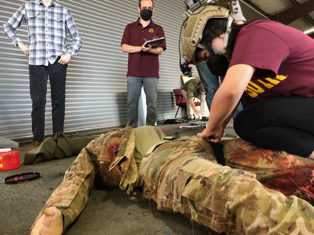 HumanFIRST Lab researchers working with a military manikin
