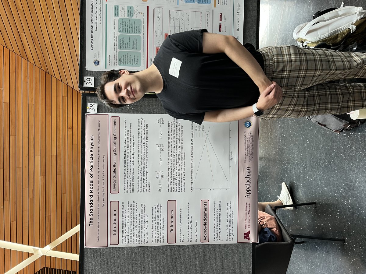 Student presenting research poster at Undergraduate Research Symposium.