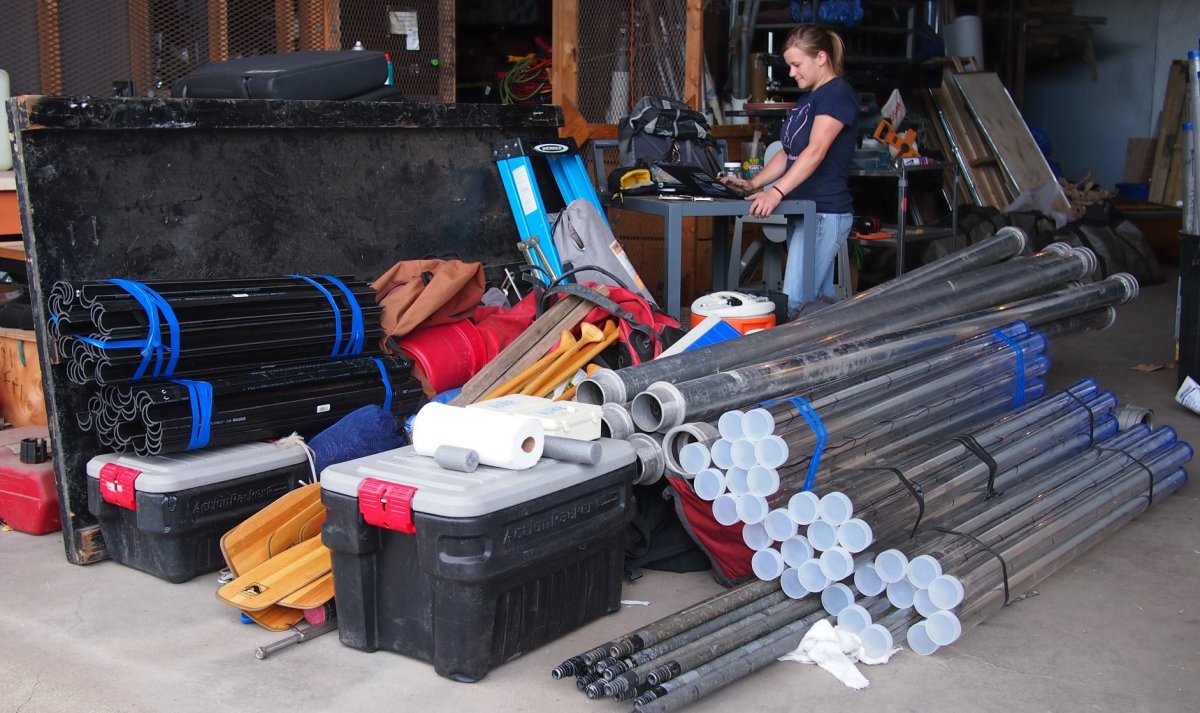 A large pile of coring equipment sits in a garage awaiting shipping