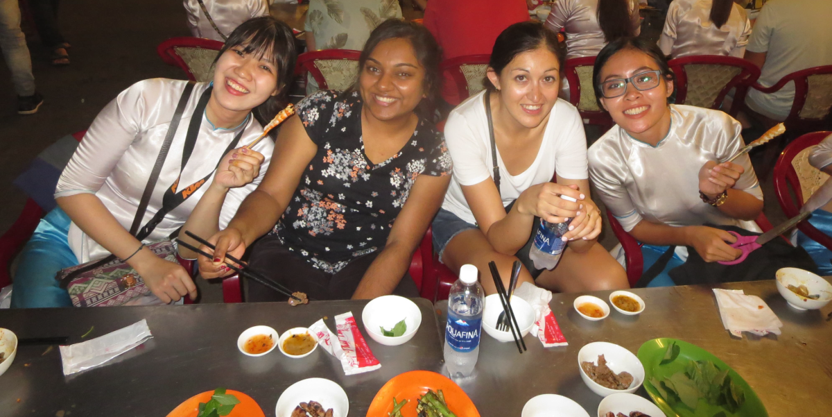 MOT students and tour guides enjoying a meal together at a market in Ho Chi Minh City, Vietnam