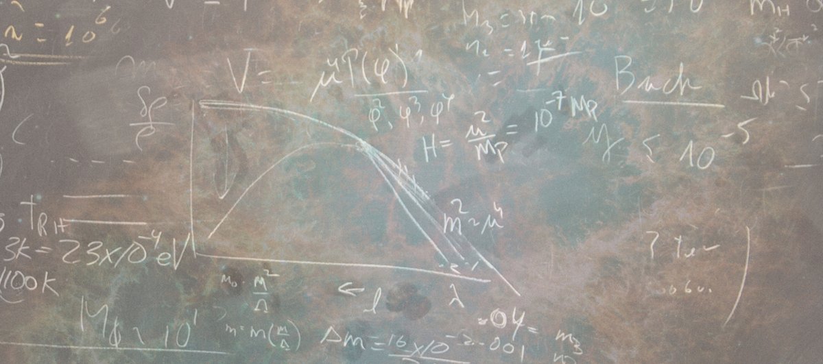 Chalkboard image of physics equations